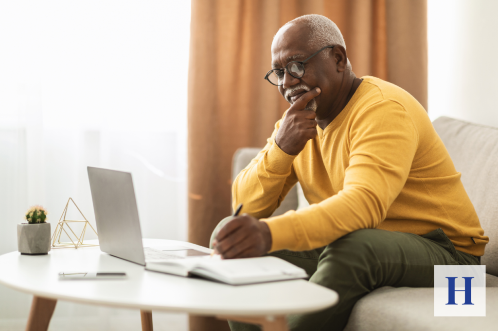 A couple reviews their retirement plan, aware that longevity risk and other retirement risks could impact how long their savings will last.