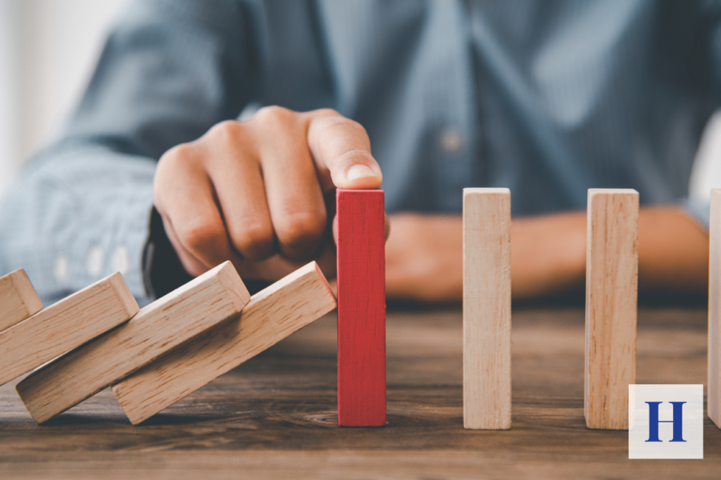 A couple reviews their retirement portfolio, unaware that sequence-of-return risk and longevity risk may be working together to threaten their long-term plan.